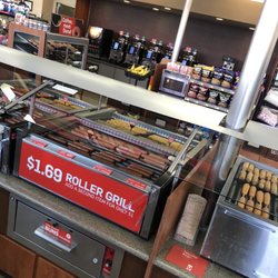 Hot rolling food even has the microwave for customers convenience unfortunately this location does not have toppings for your hotdog