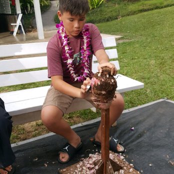 Toa Luau - Learning how to peel fruit old school style.  Just one of the many fun activities !! - Cultural Center Near Me - Haleiwa, Hawaii