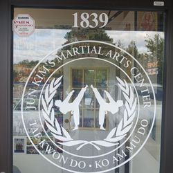 Jun Kim's Martial Arts Center - The world tyquando federation emblem of master Kim Jun