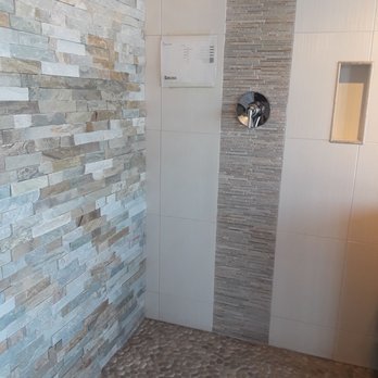 The Tile Shop - a walk in shower with a tiled floor - Flooring Near Me - Tempe, Arizona