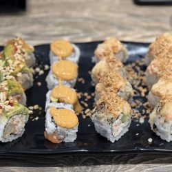 Sushi Hana Lynnwood - (Left to right) Scorpion Roll, Spicy Salmon Roll, Garlic Lover Roll x2
