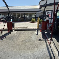 Sierra Express Car Wash - Nozzle disconnected to the hoses and nobody couldn't care less.