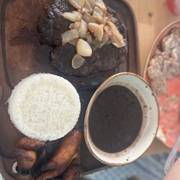 My dish. Steak with onions.. steak was not good and cooked properly!