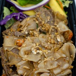Pad See Ew Happy Meal, with Beef: $19.95; $21.72 with tax. Included, but not shown: two slices of chive pancake, one spring roll. Take-out.