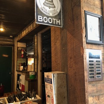 Beefmaster Steakhouse - Old phone sign and stamp dispenser on the wall, I don't think it would work. - Steakhouses Near Me - Ballinger, Texas