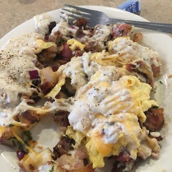 Red Apple Cafe - Ultimate Potato Breakfast with Bacon, and Country Gravy smothering the whole thing - Breakfast & Brunch Near Me - Fresno, California Red Apple Cafe - Ultimate Potato Breakfast with Bacon, and Country Gravy smothering the whole thing - Breakfast & Brunch Near Me - Fresno, California