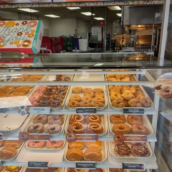 Krispy Kreme - Another bountiful choice of delicious donuts with the menu board in the background! - Donuts Near Me - Rockville, Maryland Krispy Kreme - Another bountiful choice of delicious donuts with the menu board in the background! - Donuts Near Me - Rockville, Maryland