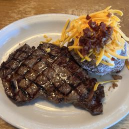 Ribeye with load baked potato Ribeye with load baked potato