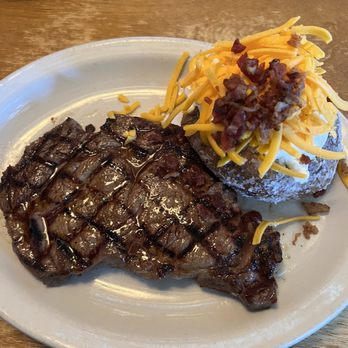 Texas Roadhouse - Ribeye with load baked potato - Steakhouses Near Me - Columbia, Missouri Texas Roadhouse - Ribeye with load baked potato - Steakhouses Near Me - Columbia, Missouri