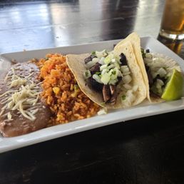 Carne asada tacos with beans and rice Carne asada tacos with beans and rice