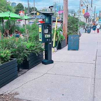 Hazel's Diner - a sidewalk lined with plants - Diners Near Me - Toronto, Ontario