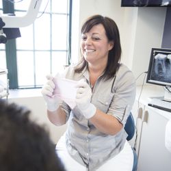 Care Endodontics - Dr. Julie Carrara with Rubber Dam