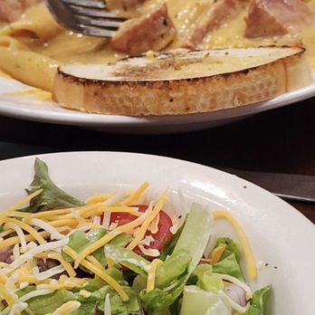 The District Bar & Grill - Creamy Cajun Pasta with homemade Andouille Sausage. And a fresh garden salad. - Bars Near Me - Harrisonville, Missouri