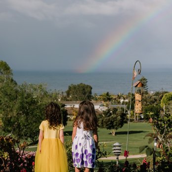 Let's Frolic Together - A perfect moment of these two little nieces watching a rainbow, captured by Let's Frolic Together - Event Photography Near Me
