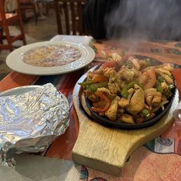 Chicken fajitas, no rice, just beans (our preference), and tortillas. Chicken fajitas, no rice, just beans (our preference), and tortillas.
