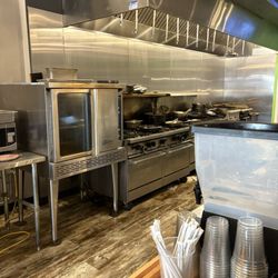 MoJo's Pasta House and Cajun Cook Shack - This picture with the stack of pots and pans is all the goodness and work that goes into this food!