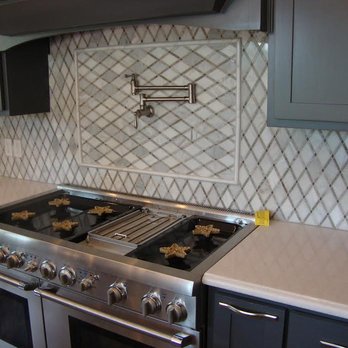 Timeless Surfaces By Cable Tile - a kitchen with stainless steel appliances - General Contractors Near Me - Tulsa, Oklahoma Timeless Surfaces By Cable Tile - a kitchen with stainless steel appliances - General Contractors Near Me - Tulsa, Oklahoma