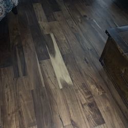 Floor & Decor - Almost the whole board loosing its color.  Nothing has been used on the floor.