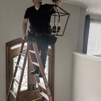 Local Electrician Magicians - Upgrading a customer's home by installing a new chandelier. - Electricians Near Me Local Electrician Magicians - Upgrading a customer's home by installing a new chandelier. - Electricians Near Me