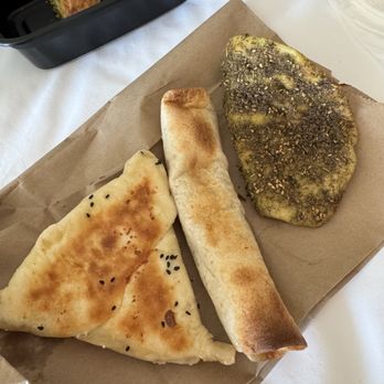 Sana'a Cafe - Left to right: baklava, cheese pocket bread, chicken roll, zaatar - Coffee & Tea Near Me - San Francisco, California Sana'a Cafe - Left to right: baklava, cheese pocket bread, chicken roll, zaatar - Coffee & Tea Near Me - San Francisco, California