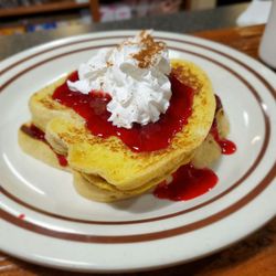 Dutchman’s Diner - Stuffed French toast with strawberry topping and whip cream dusted with cinnamon.