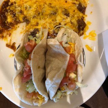 Uncle Julio's - Tacos and I believe they are beef enchiladas with chili sauce. - Tex-Mex Near Me - Oklahoma City, Oklahoma Uncle Julio's - Tacos and I believe they are beef enchiladas with chili sauce. - Tex-Mex Near Me - Oklahoma City, Oklahoma
