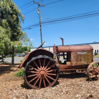 The Green Machine - an old tractor on the ground - Landscaping Near Me - Bloomfield, Connecticut