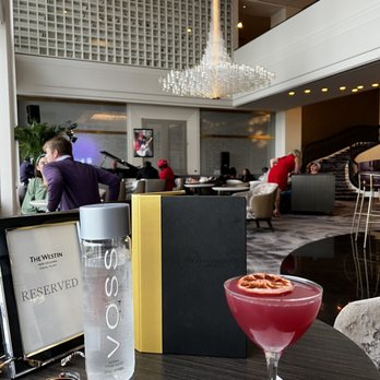 Observatory Eleven - a cocktail in a glass on a table - Cocktail Bars Near Me - New Orleans, Louisiana Observatory Eleven - a cocktail in a glass on a table - Cocktail Bars Near Me - New Orleans, Louisiana