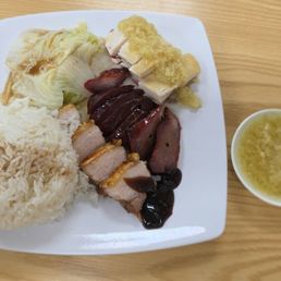 Three item combo plate. Pork belly, char siu, scallion chicken. Three item combo plate. Pork belly, char siu, scallion chicken.