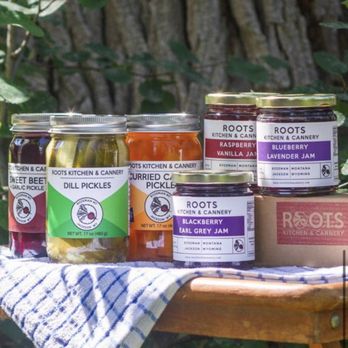 Roots Kitchen & Cannery - jars of pickles on a table - Bakeries Near Me - Belgrade, Montana Roots Kitchen & Cannery - jars of pickles on a table - Bakeries Near Me - Belgrade, Montana