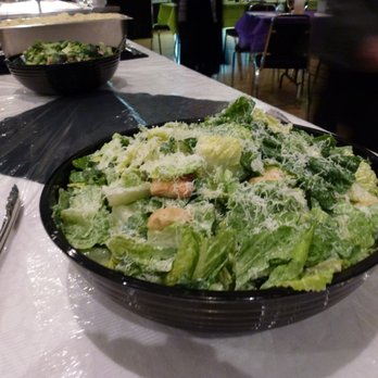 Paulina's Catering - Paulina's Classic Caesar Salad....house made dressing, scratch made croutons and bacon bits. Topped with freshly grated parmesan! - Caterers Near Me
