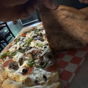 A Touch Of Basil - Under side of the pie - Italian Near Me - Cocoa Beach, Florida