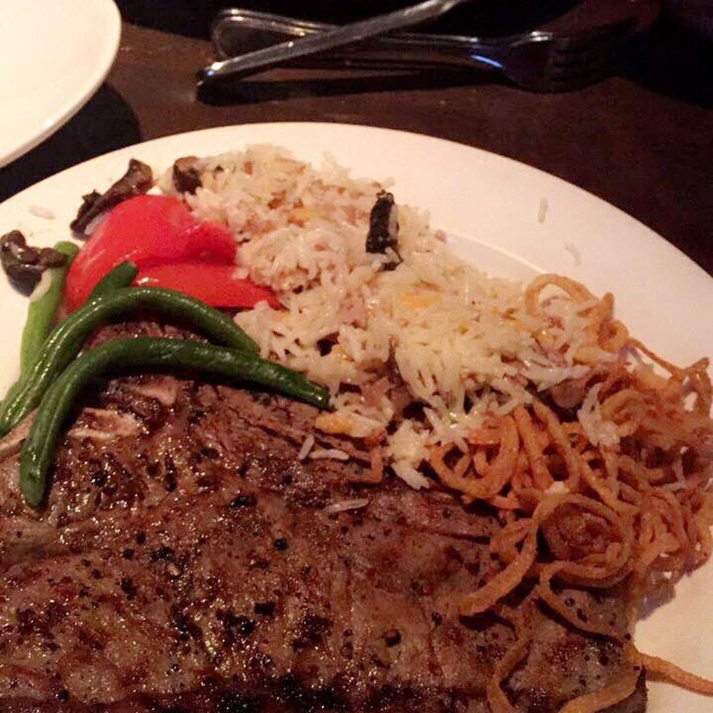 20 oz T-bone steak with rice , veggies and fried onions . 20 oz T-bone steak with rice , veggies and fried onions .
