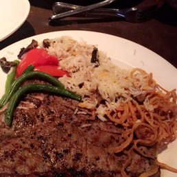 20 oz T-bone steak with rice , veggies and fried onions . 20 oz T-bone steak with rice , veggies and fried onions .