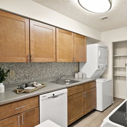 Roxalana Hills Apartments - This is our contemporary kitchen style, complete with soft-close cabinetry, glass tile backsplash, and luxury plank flooring.
