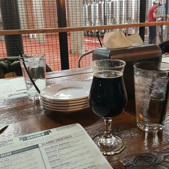 Masthead Brewing - Table by the beer brewing and my stout - Breweries Near Me - Cleveland, Ohio Masthead Brewing - Table by the beer brewing and my stout - Breweries Near Me - Cleveland, Ohio