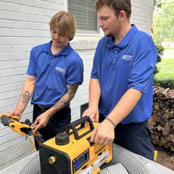F H Furr Plumbing Heating Air Conditioning & Electrical - Techs working together to solve an HVAC problem a customer is experiencing.