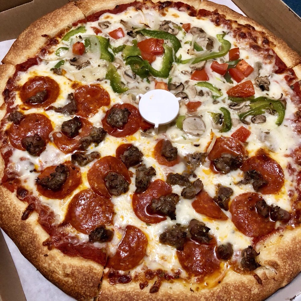 Carlo's Pizza House - Large pizza with pepperoni and sausage on one side and veggies on the other. - Pizza Near Me - Downey, California Carlo's Pizza House - Large pizza with pepperoni and sausage on one side and veggies on the other. - Pizza Near Me - Downey, California