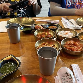 Char Haus BBQ - The banchan sides and the three sauces - soybean paste (salty), salsa, and green chimichurri (spicy) - Korean Near Me - New York, New York