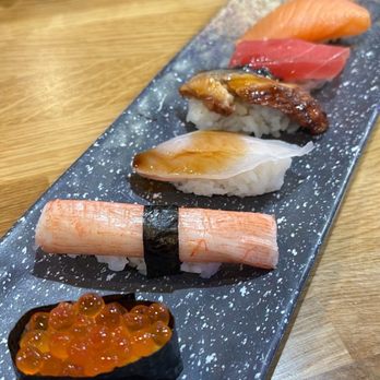 Sushi Damu - Nigiri (from front to back: smelt, imitation crab, tilapia, eel, tuna, smoked salmon) - Sushi Bars Near Me - Tustin, California Sushi Damu - Nigiri (from front to back: smelt, imitation crab, tilapia, eel, tuna, smoked salmon) - Sushi Bars Near Me - Tustin, California