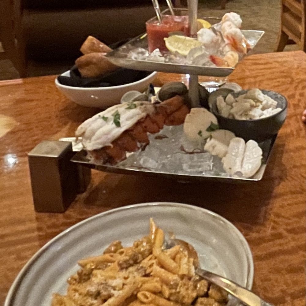 Chefs pasta (penne with rose cream sauce and Italian sausage) and shellfish tower. Exceptional