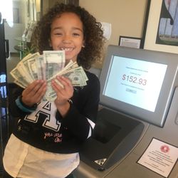East County Schools Federal Credit Union - Lola turning her piggy bank coins into cash!