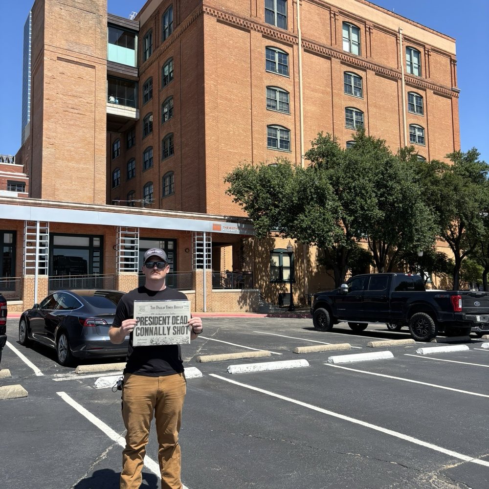 JFK Memorial - Parking lot outside memorial, holding a newspaper from the day after JFK was shot. - Museums Near Me - Fort Worth, Texas JFK Memorial - Parking lot outside memorial, holding a newspaper from the day after JFK was shot. - Museums Near Me - Fort Worth, Texas