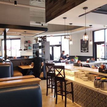 Broken Yolk Cafe - a man standing at the counter - Breakfast & Brunch Near Me - Santee, California