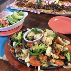 Vegetable fajitas and you can see the 12 taco plate behind it