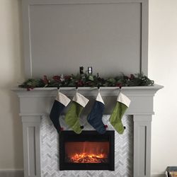 Crown Finish - Fireplace built in and electric fireplace install. Mosaic marble tile install. And painted to perfection