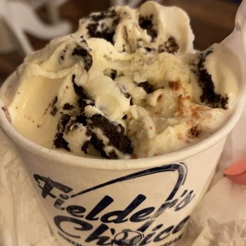 Fielder's Choice Ice Cream - a hand holding a cup of ice cream - Ice Cream & Frozen Yogurt Near Me - Old Orchard Beach, Maine