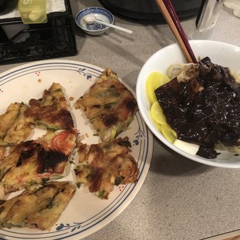 Wang Ja Jang - Seafood pancake (already ate some), jajangmyun (1/3 shown) - Korean Near Me - Rockville, Maryland Wang Ja Jang - Seafood pancake (already ate some), jajangmyun (1/3 shown) - Korean Near Me - Rockville, Maryland