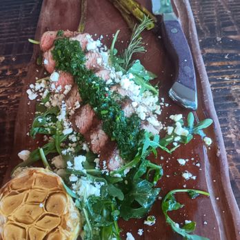 The Hive Bar & Grill - 9/14/2024.  Charred Angus Tri Tip ($29):  small portion, cooked nicely but needs more salt. Roasted garlic enhances this dish, 3.5/5 stars. - American Near Me - Wildomar, California