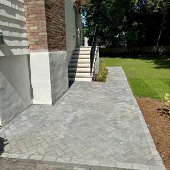 Wollaston Development - New paver walkway that wraps around to a beautiful patio, hardscaping - Landscaping Near Me - Belmont, Massachusetts